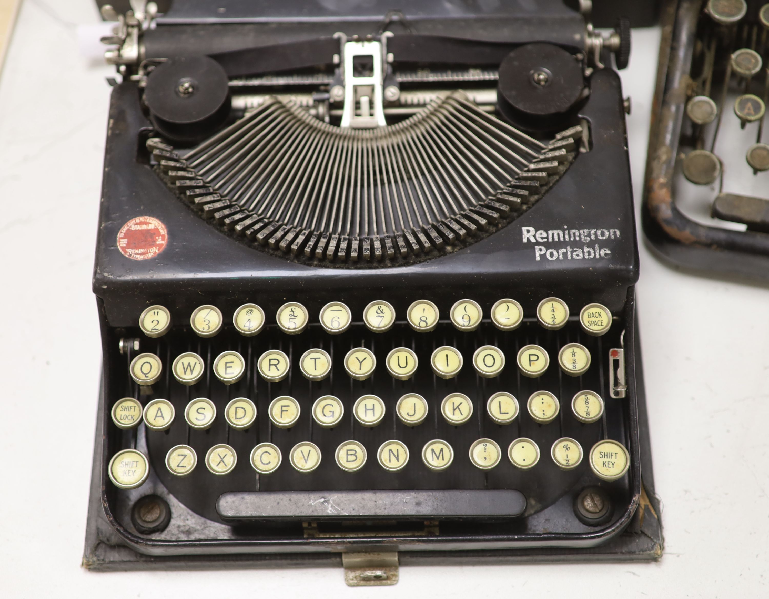 Three vintage typewriters: Underwood Standard portable, Remington Portable and Royal Typewriter Company
